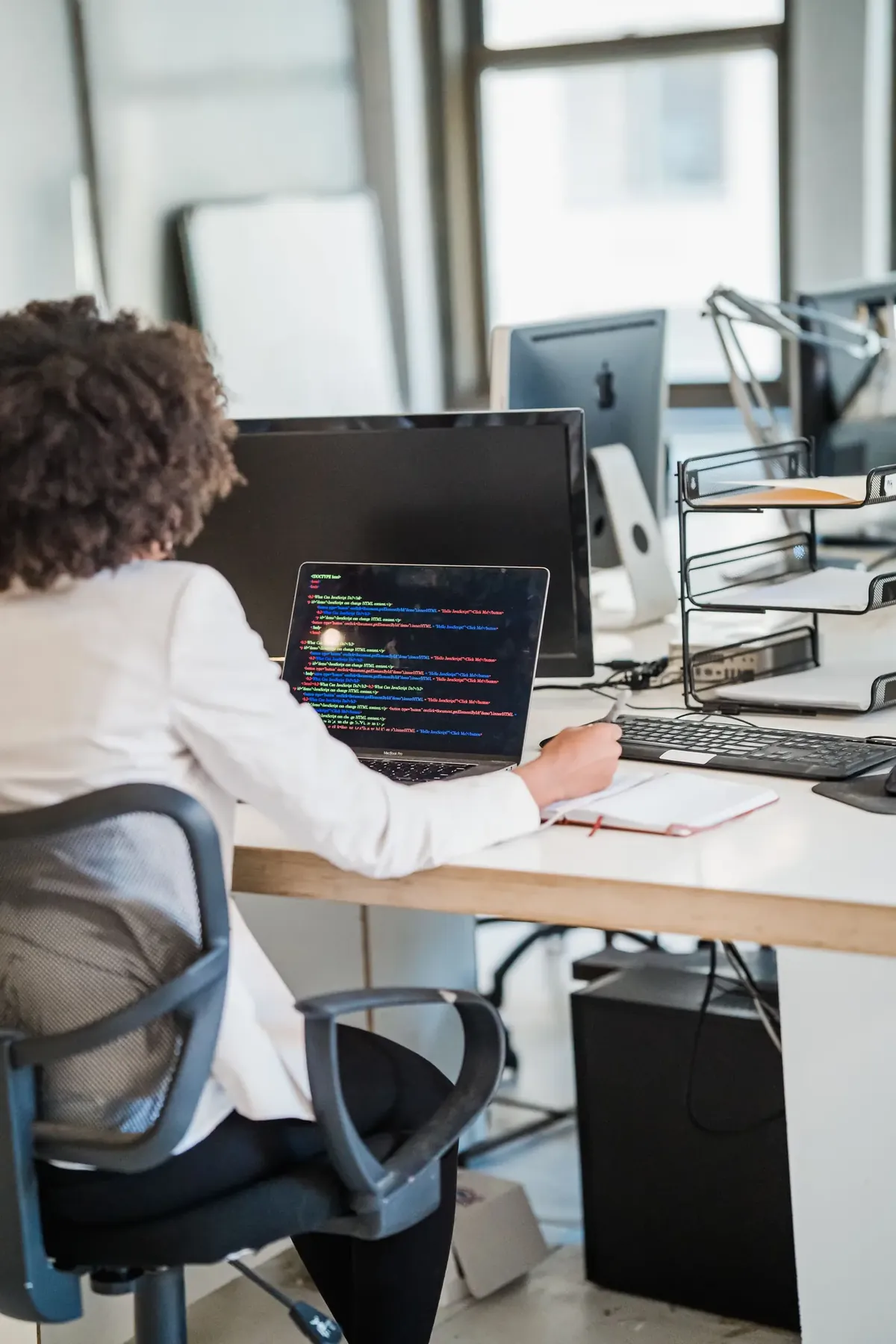 IT professional working with code and workplace systems